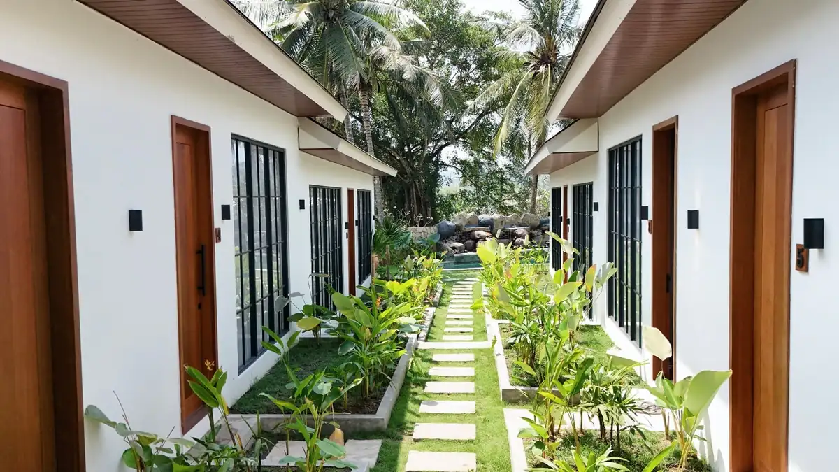 Malasama Suites Hotel — tropical garden walkway